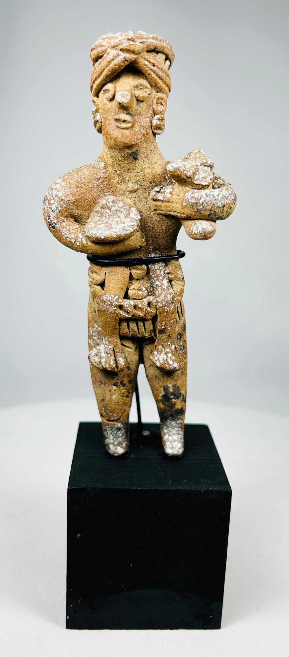 Pre-Columbian Nayarit terracotta figure holding ritual offerings