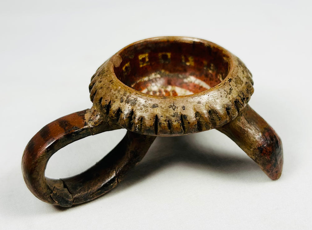 Small Mesoamerican tripod ritual bowl with painted decoration