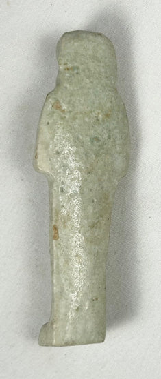 Egyptian faience ushabti with crossed arms and spiritual symbolism