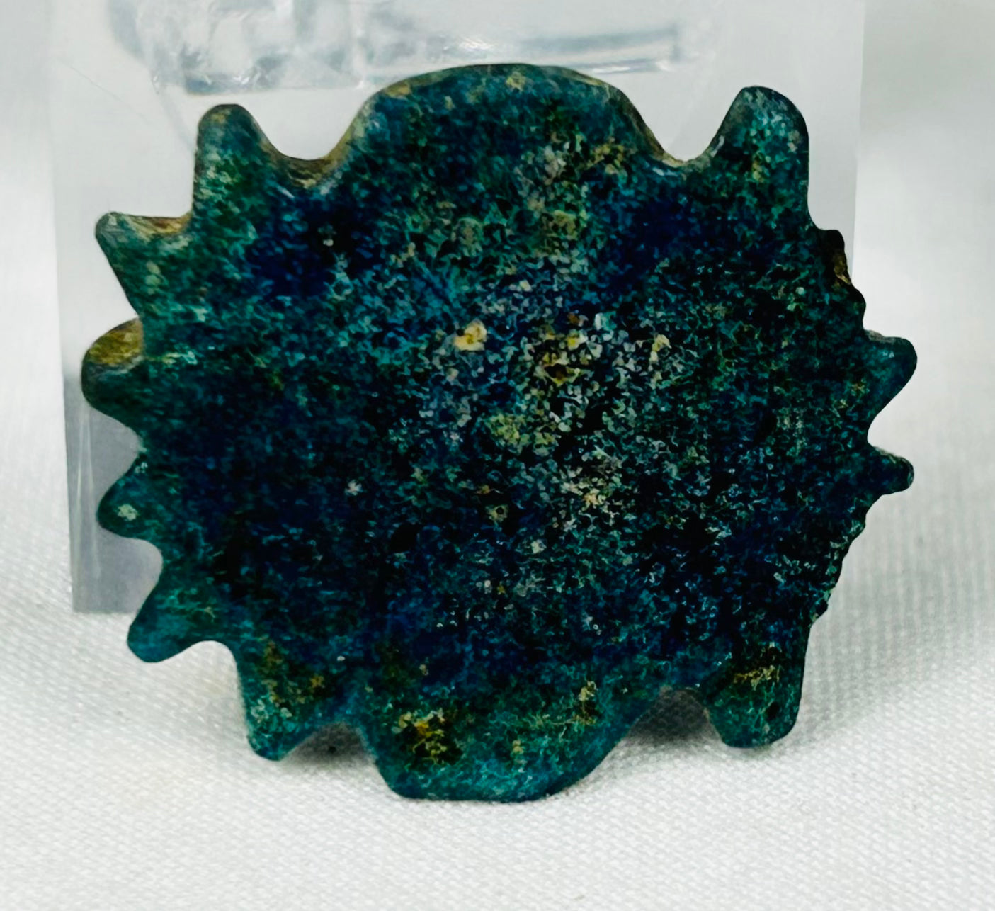 Ancient Egyptian decorative faience bead with textured radiating design
