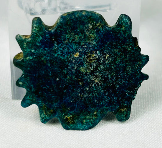 Ancient Egyptian decorative faience bead with textured radiating design