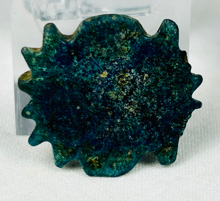 Ancient Egyptian decorative faience bead with textured radiating design