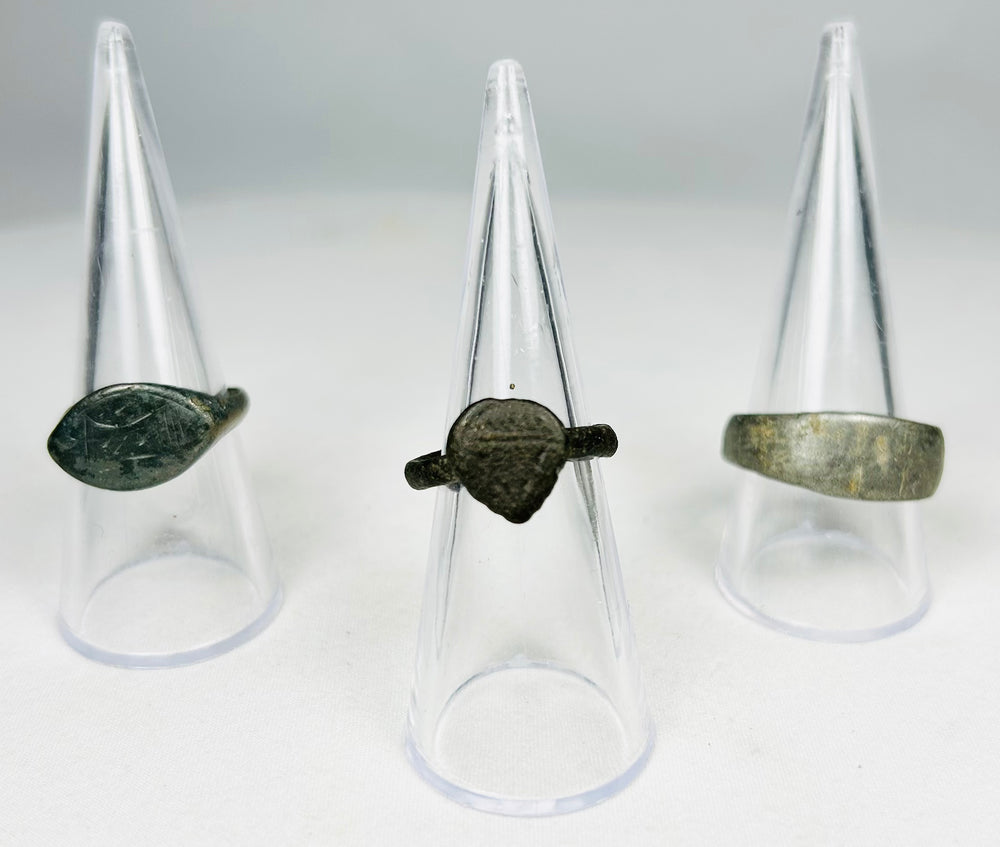 Collection of ancient bronze rings showing patina and excavation aging