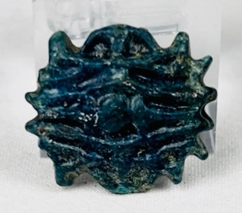 Late Period Egyptian faience starburst amulet with burial patina