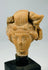 Detailed view of Mediterranean terracotta head fragment emphasizing sculptural artistry and fine facial modelled features.