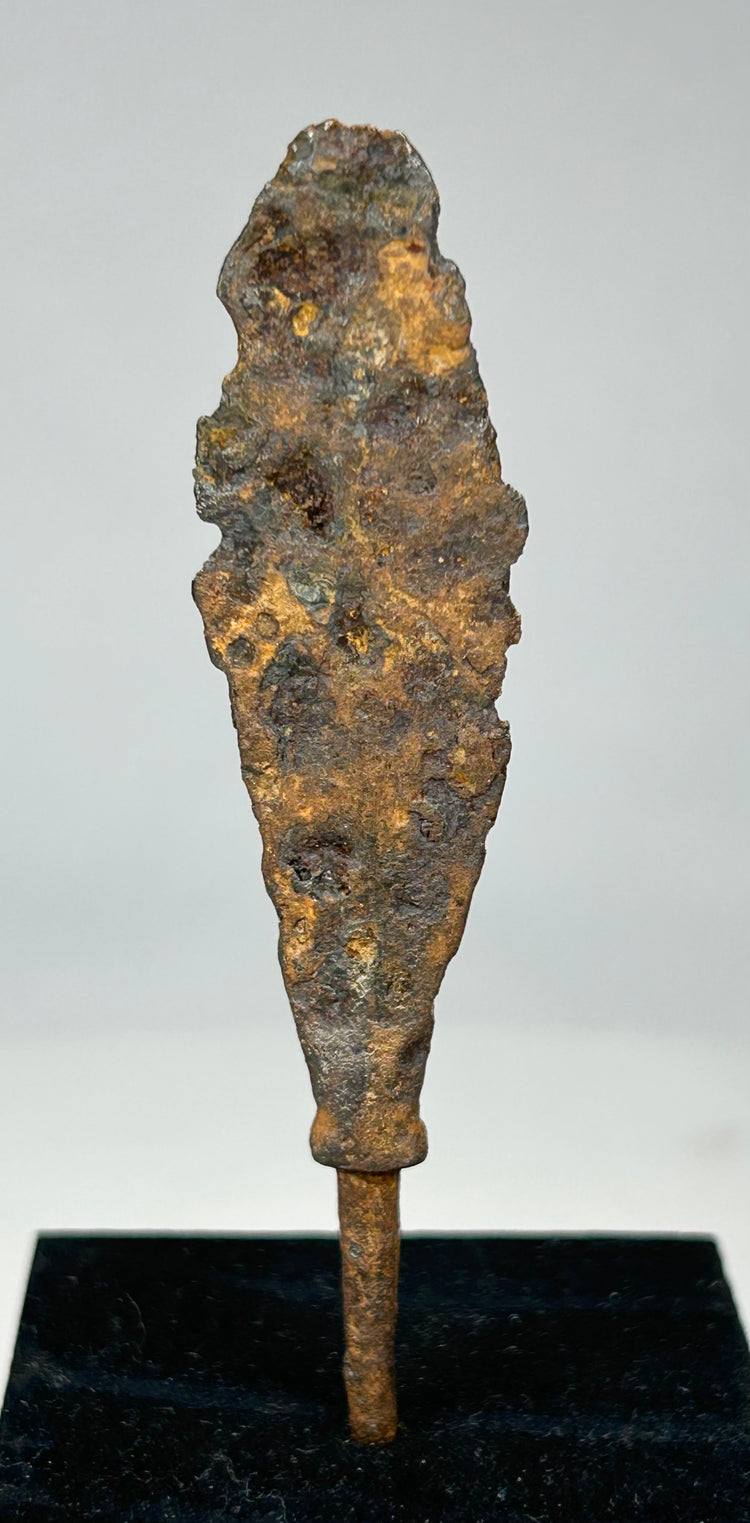 Archaeological iron weapon relic with aged brown and orange oxidation tones
