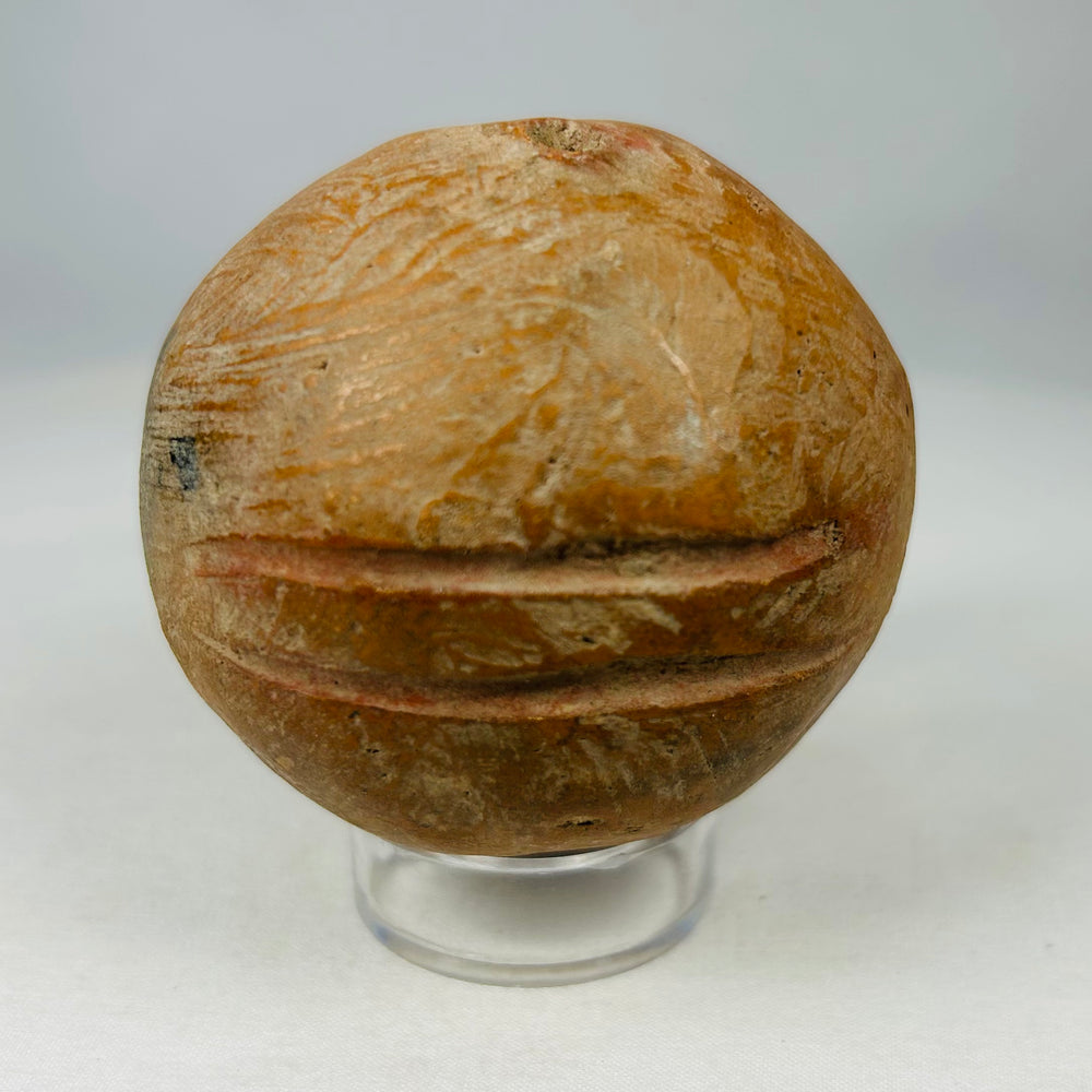 Ancient Mesoamerican terracotta rattles with pierced sound apertures and natural earthen patina.