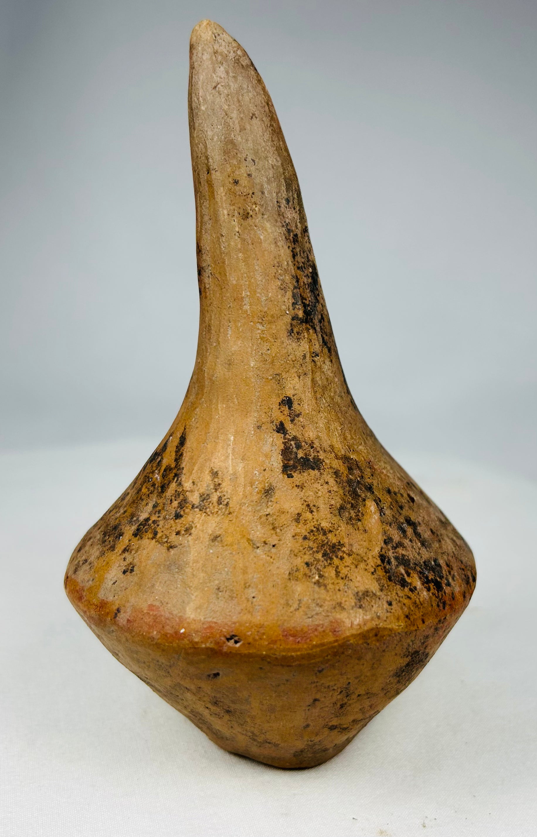 Archaeological Pre-Columbian ceramic rattles displaying centuries-old burial patina and age wear.