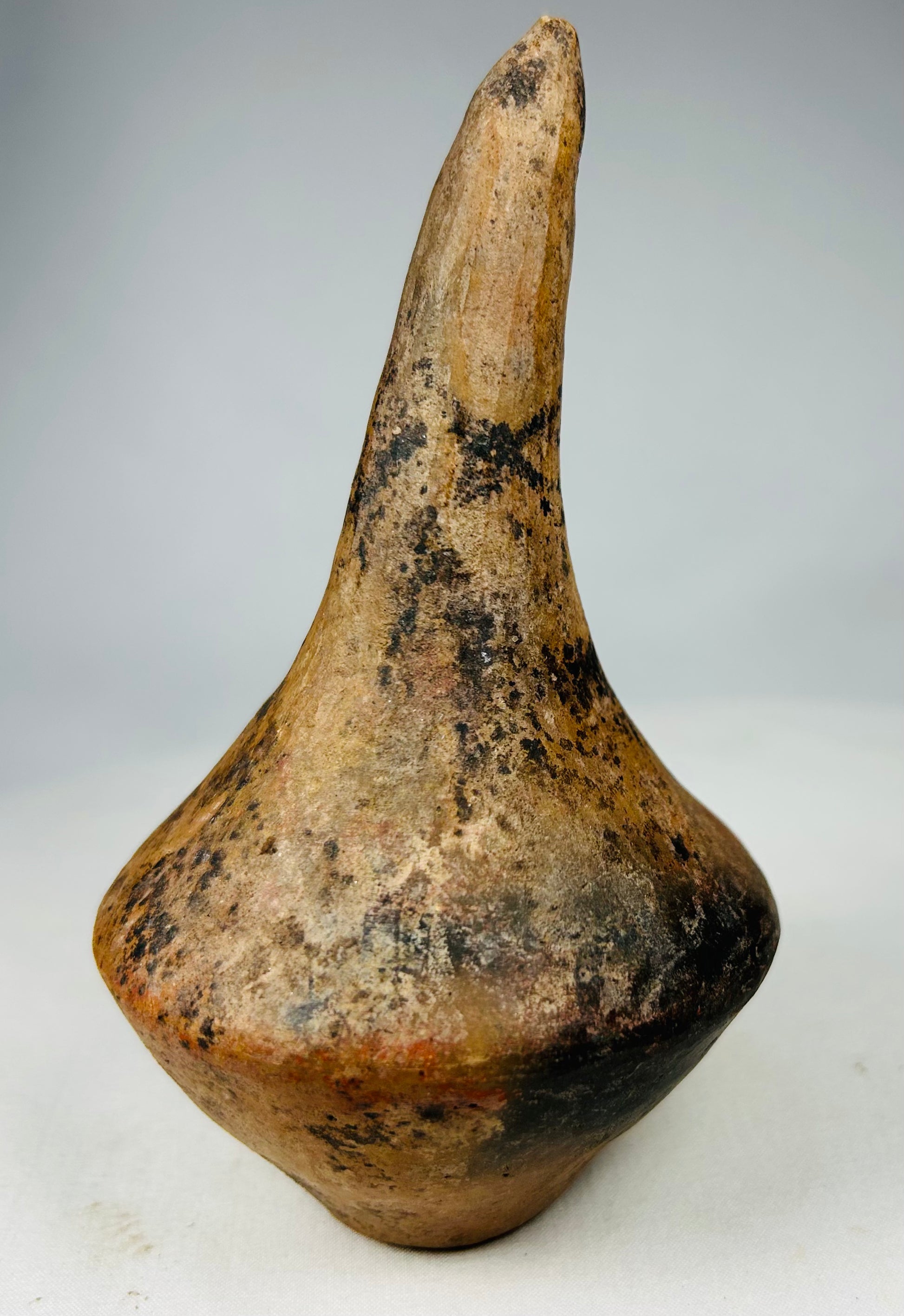 Pre-Columbian ritual sound instruments formed from low-fired terracotta with internal pellets.