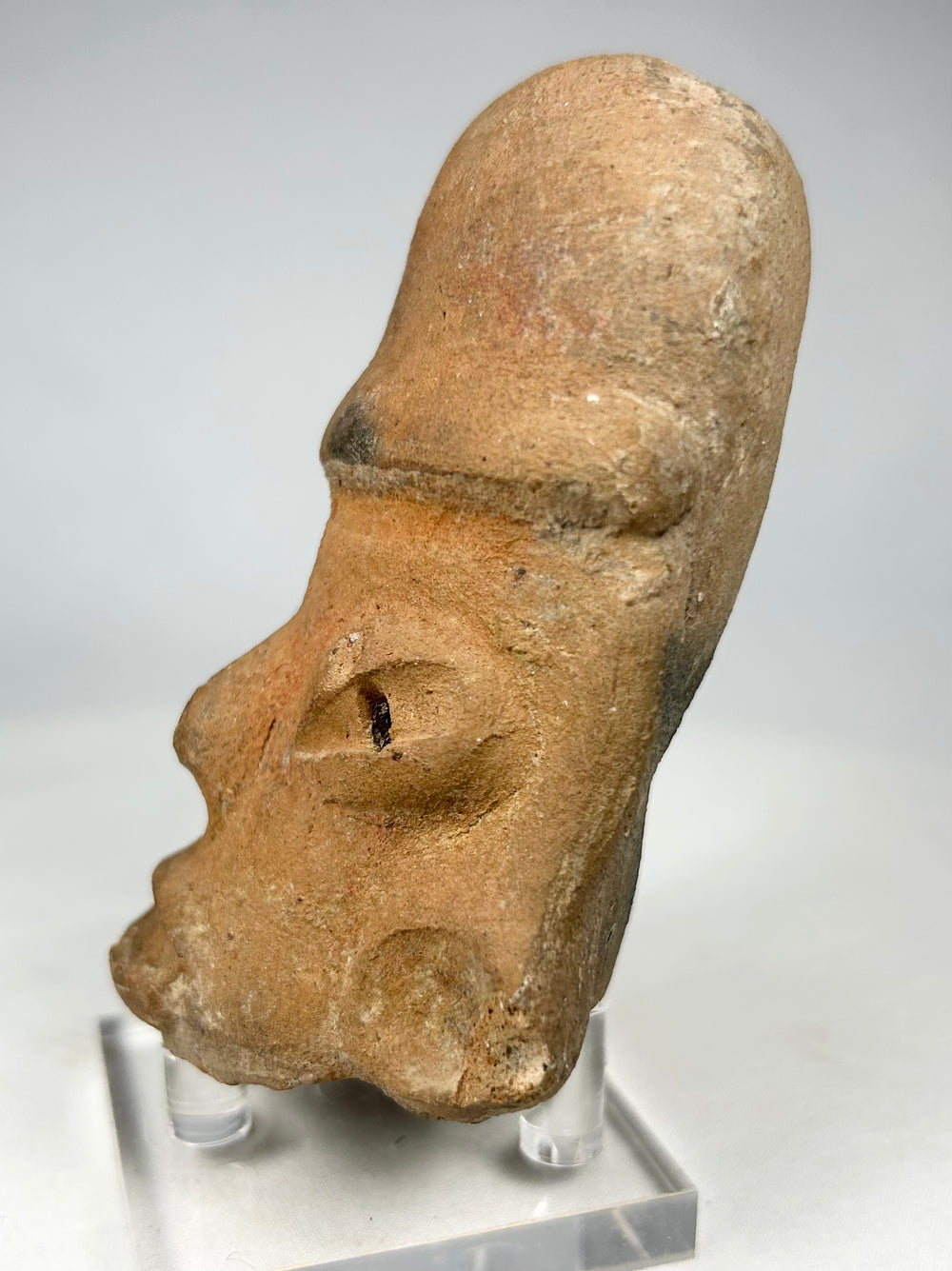 Authentic Pre-Columbian terracotta sculptural head with hollow construction and mineral encrustation.