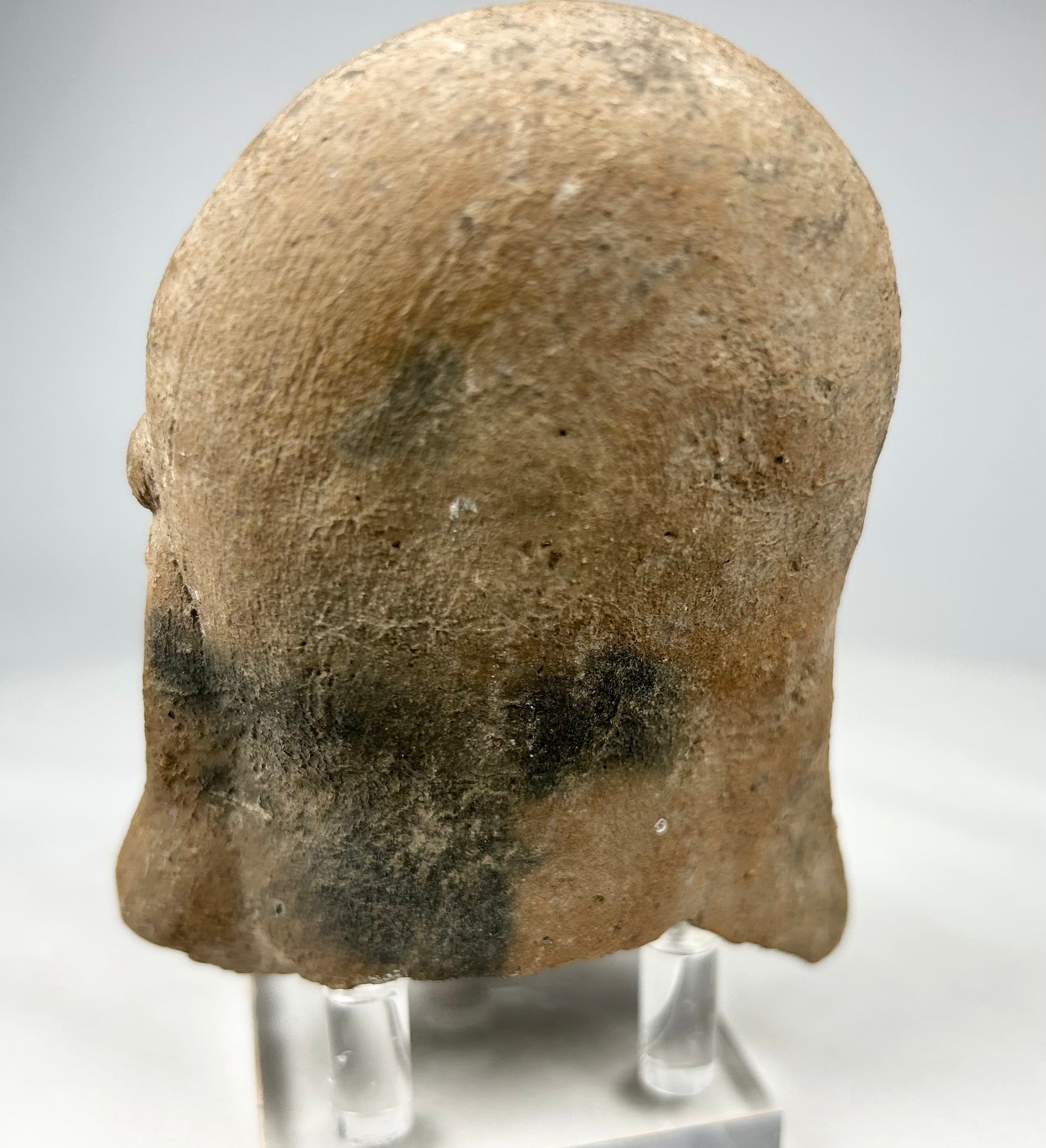 Ritual terracotta head from the Pre-Columbian Americas displaying ancestral or spiritual symbolism.
