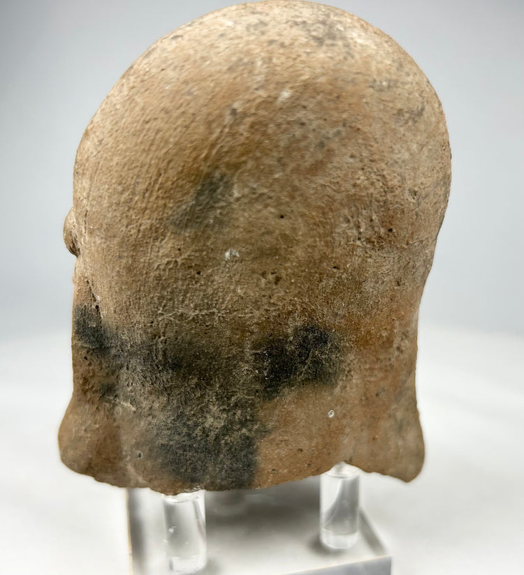 Ritual terracotta head from the Pre-Columbian Americas displaying ancestral or spiritual symbolism.