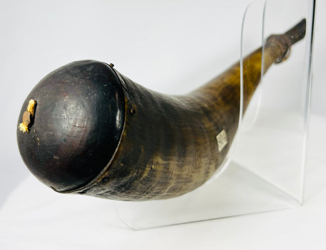 Early firearms accoutrement powder horn showing centuries-old wear and original inventory markings.