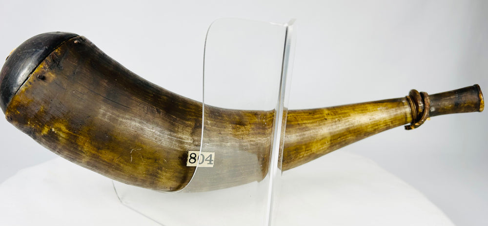 Historic powder horn from the black powder era with wooden fittings and museum collection numbers.
