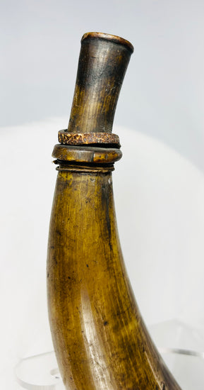 Antique powder horn with domed wooden base and rich time-softened patina from prolonged use.