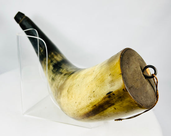 Detailed view of iron suspension ring on an early black powder horn