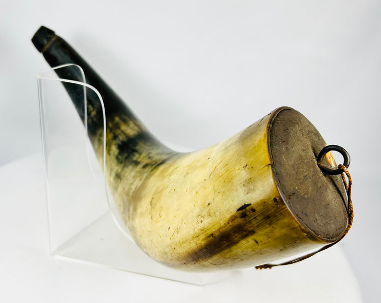 Detailed view of iron suspension ring on an early black powder horn