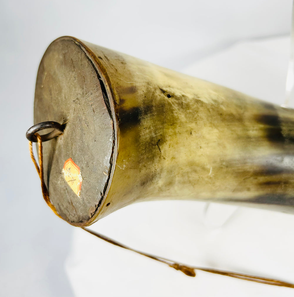 Wooden base plug and suspension hardware on historic firearms powder horn