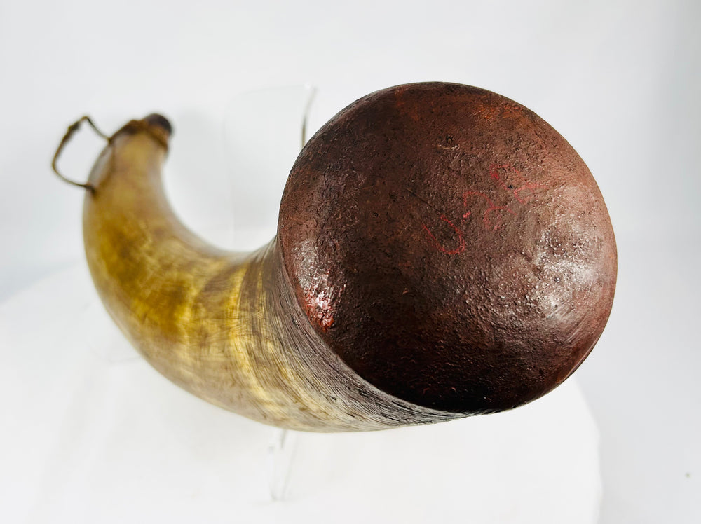 Historic black powder horn with wooden base plug and leather suspension