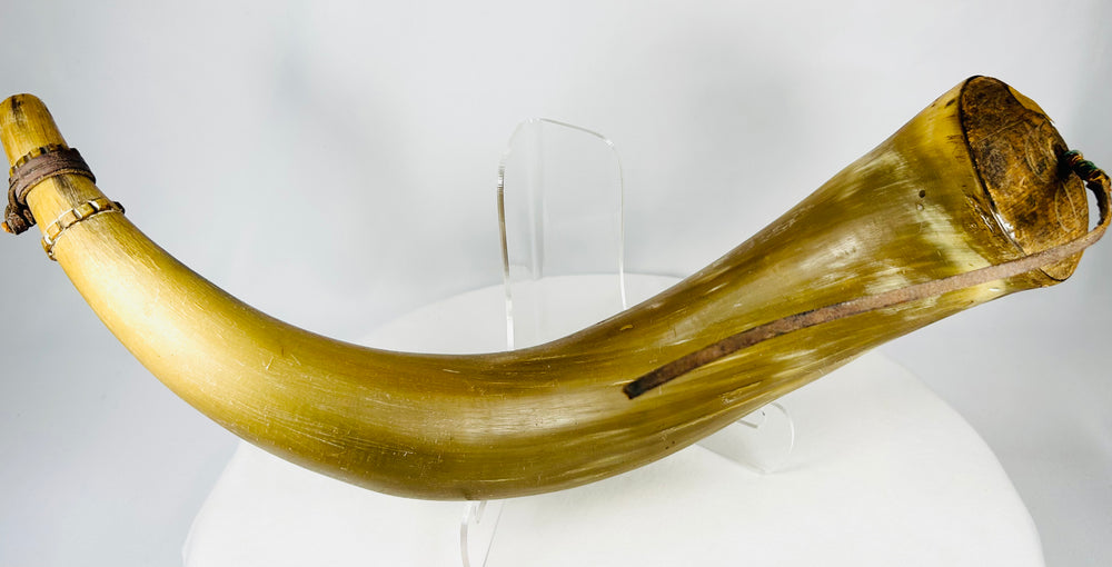 Historic flintlock-era priming horn made from natural animal horn