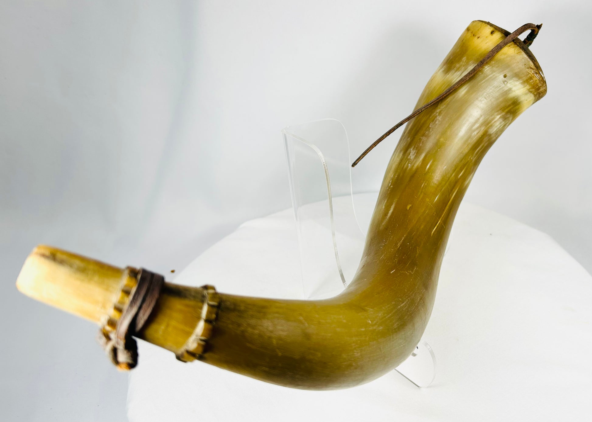 Personal priming horn with carved initials and aged horn patina