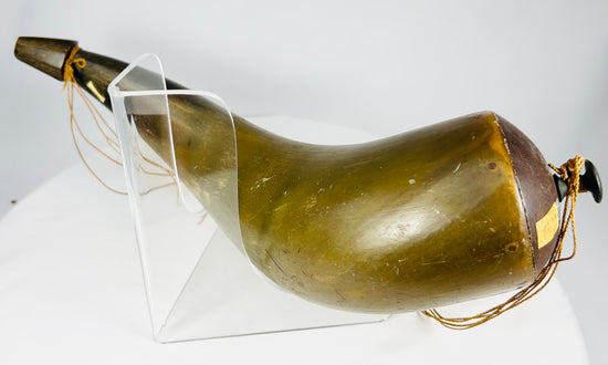 Close-up of cord attachment and stopper on historic horn container