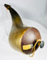 Close-up of wooden stopper and cord on historic horn vessel
