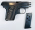 FN Browning Model 1906 displayed with its detached magazine, checkered grip, oval FN emblem, and visible ejection port.