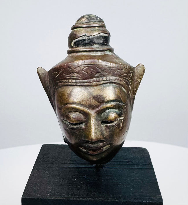 Southeast Asian Buddhist metal sculpture with decorative crown and naturally aged surface