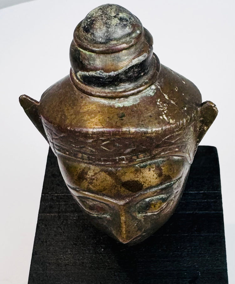 Thai or Cambodian style crowned Buddha head with aged patina and traditional Buddhist iconography