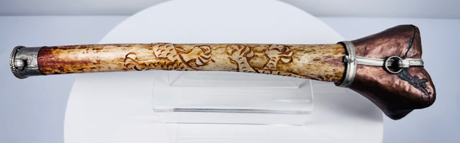 Tibetan Buddhist human bone kangling ceremonial trumpet with intricate dragon carving, late 19th to early 20th century