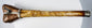 Carved Tibetan kangling human bone ritual instrument featuring detailed dragon motifs and fitted metal terminal