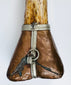 Carved dragon detail on Tibetan Buddhist kangling ritual trumpet made from human femur bone