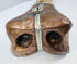 Historic Tibetan Buddhist ritual trumpet displaying intricate carved bone craftsmanship and aged metal mounts