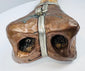 Historic Tibetan Buddhist ritual trumpet displaying intricate carved bone craftsmanship and aged metal mounts