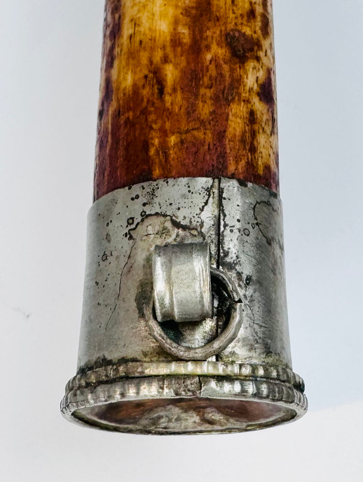 Metal-mounted end of antique Tibetan kangling human bone trumpet with traditional Himalayan craftsmanship