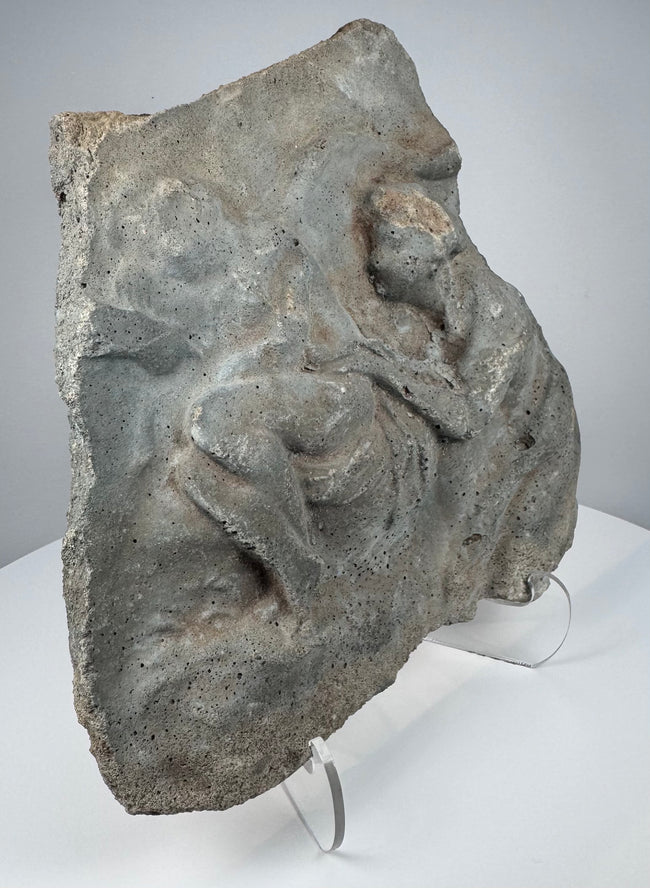 Ancient Roman volcanic stone carving with eroded figural composition, porous surface and mineral deposits