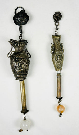 Qing Dynasty silver hanging ornament featuring traditional floral motifs