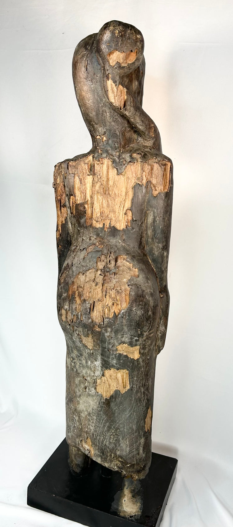 Borneo tribal wooden ancestor figure with expressive carved face