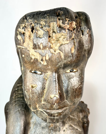 Indonesian Dayak wooden sculpture with inset eyes and ritual wear