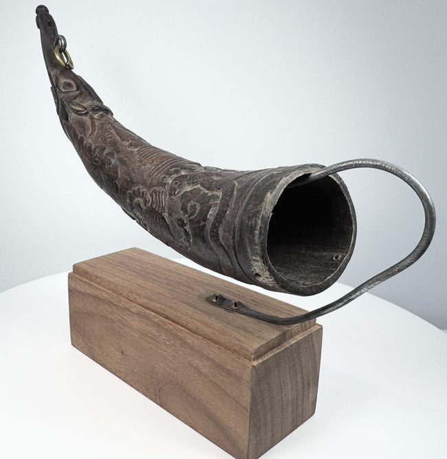 Tibetan mustard-seed ritual horn with makara finial, carved horn body, and traditional 18th–19th century form.