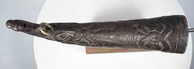 Authentic Tibetan ritual horn from the Himalayan region, carved with symbolic details and used in purification ceremonies.