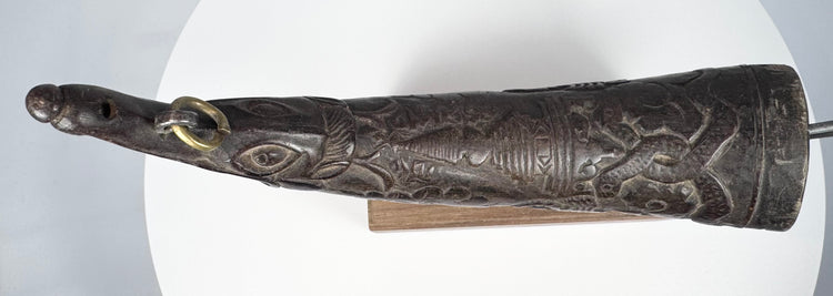 Authentic Tibetan ritual horn from the Himalayan region, carved with symbolic details and used in purification ceremonies.