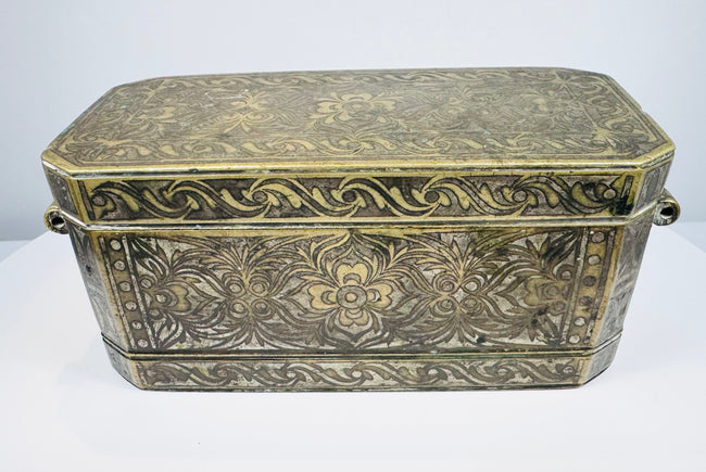 Late 18th to early 19th-century Philippine betel nut box with intricate brass floral inlay and aged mixed-metal surface.