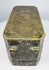 Top of a Philippine betel nut box displaying dense floral scrollwork and symmetrical brass-inlaid decoration across the lid.
