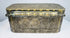 End profile of an antique Filipino betel box showing the raised lid, decorative metalwork, and side-mounted suspension ring.