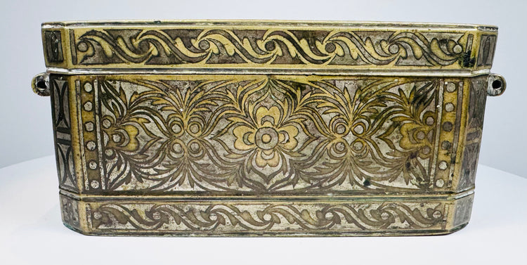 Opposite end of the Philippine betel box showing engraved ornament, metal construction, and original fastening hardware.