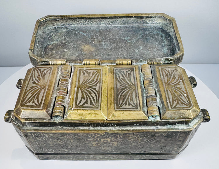 Open Philippine betel nut box revealing four individual hinged interior compartments used for betel chewing ingredients.