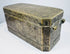 Long side of a late 18th-century Philippine betel box with repeating floral scrollwork and decorative brass inlay.