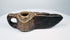 Early Islamic carved stone oil lamp from the Middle East, circa 7th–12th century CE, with geometric incised decoration.